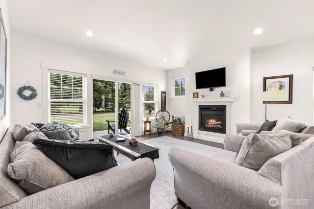 Great room in ADU with gas fireplace and slider to back wrap around patio.