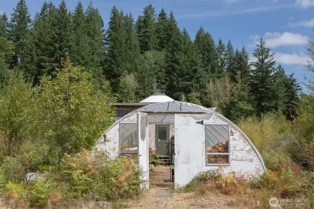 .Enter the yurt through the greenhouse.