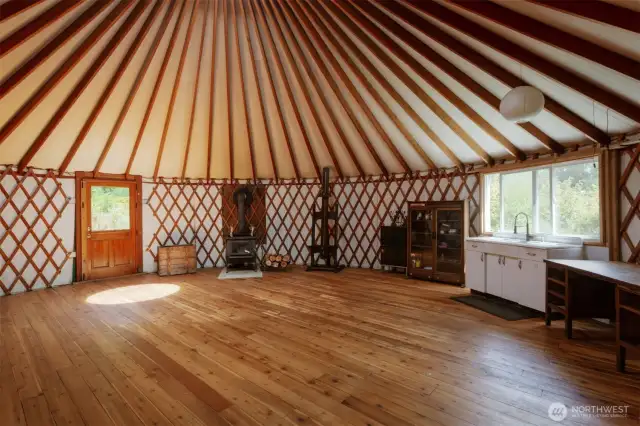 30 foot yurt makes a great common area. Sink, wood stove and propane stove.