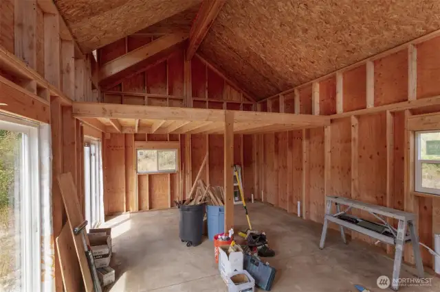 Interior looking to kitchen space and loft for sleeping