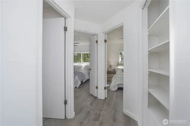 Hallway into Bedrooms 1 and 2. Storage galore!