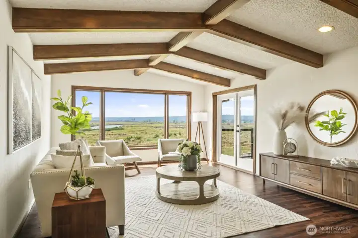 Living room has access to the large back deck.