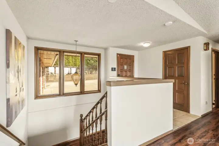 Stairs leading to the lower level are extra wide and grand