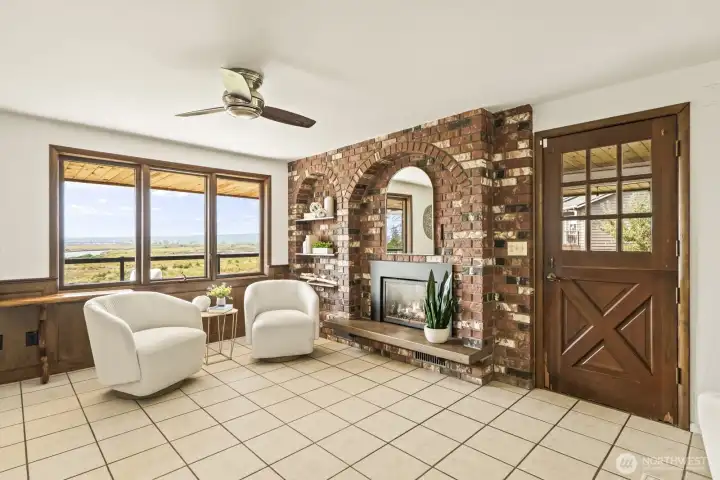 Gas fireplace in the family room with access to the yard and deck