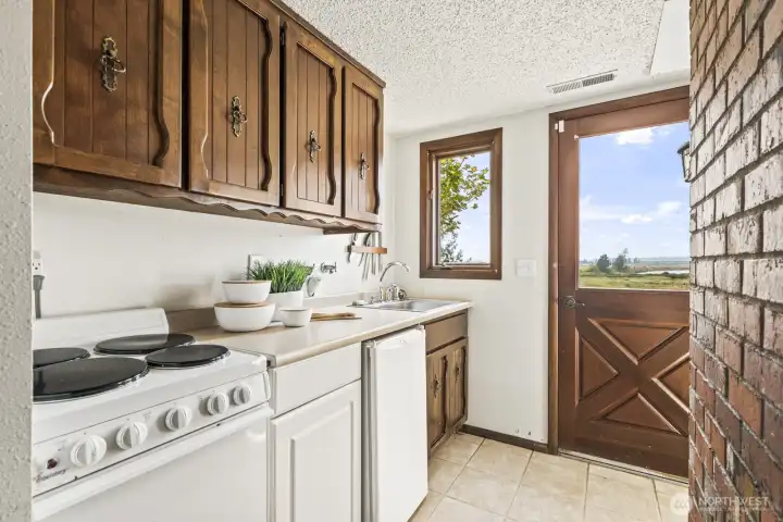 Lower level kitchen with access to the yard and zero steps. perfect for mother in law or multi generational living