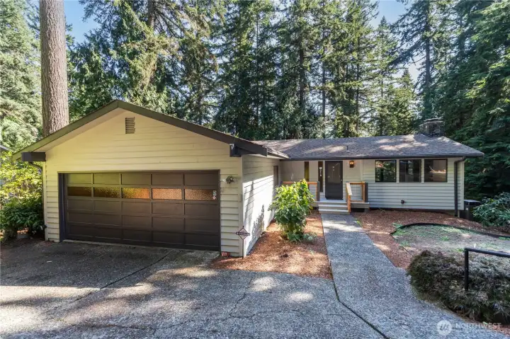 91 Drew Lane is on a cul-de-sac in the resort of Port Ludlow. With three bedrooms, 2 full baths, and two living rooms (one up, one down), this home can accommodate multi-generational living, or a home office.