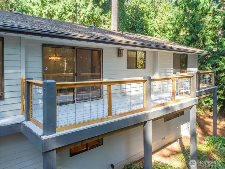 The sliding door leads in to the dining room.  The last window on the right-hand side is in the primary bedroom.