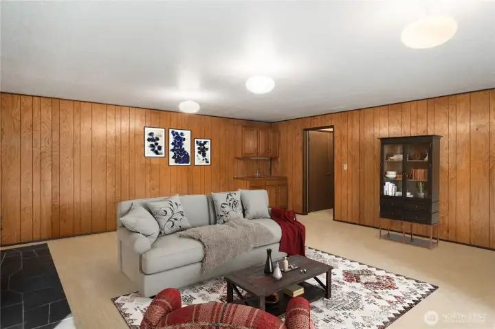 Another view of the family room downstairs.  Can you see a pool or ping pong table here, or a big screen for movies and football games?  Great space with some cool retro ceiling lights, too.