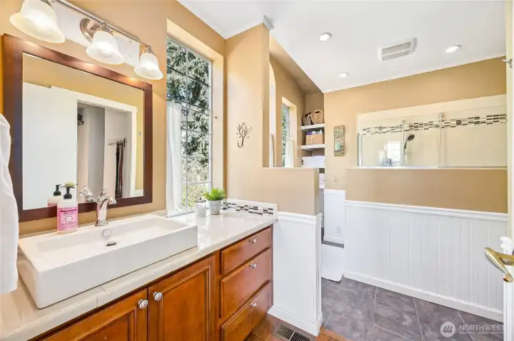 Updated private primary ensuite featuring generous natural light and stylish finishes.