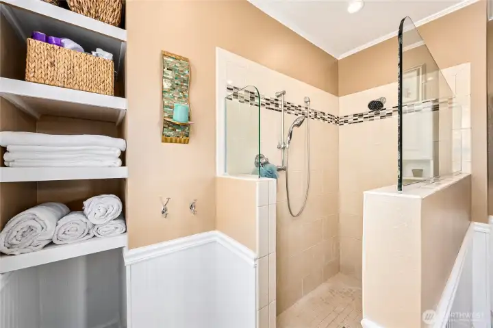 Step into the walk-in tile shower for a spa-inspired experience.