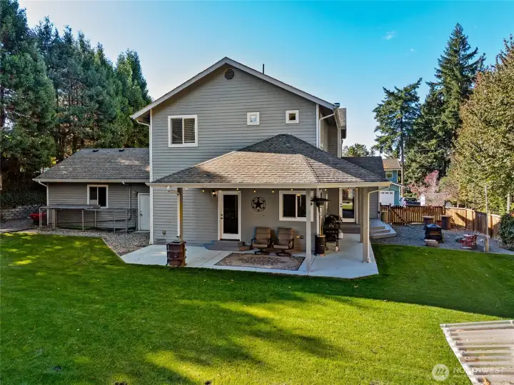 Enjoy the outdoors year-round on the covered wraparound back patio.