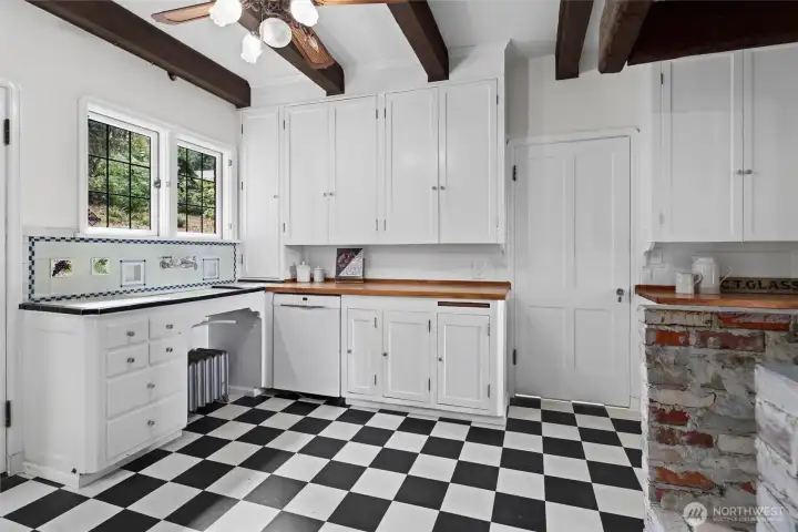 Original kitchen with classic cabinetry and historic details, preserving the home’s authentic charm and timeless character.