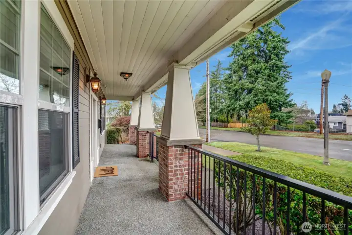 The inviting covered front porch features a charming beadboard ceiling, sleek new black railings, and is the ideal spot to greet guests on a rainy Northwest day. In summer, it’s the perfect place to sip drinks while watching the neighborhood come to life.