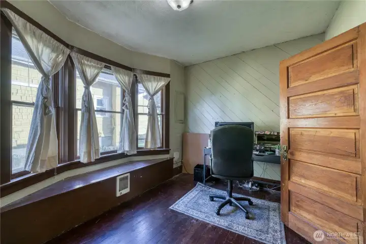 Mainfloor bedroom with bay window. Currently used as a office.