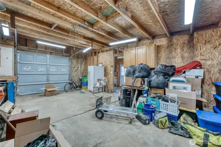 Extra deep garage with additional shop space and additional carport parking as well.