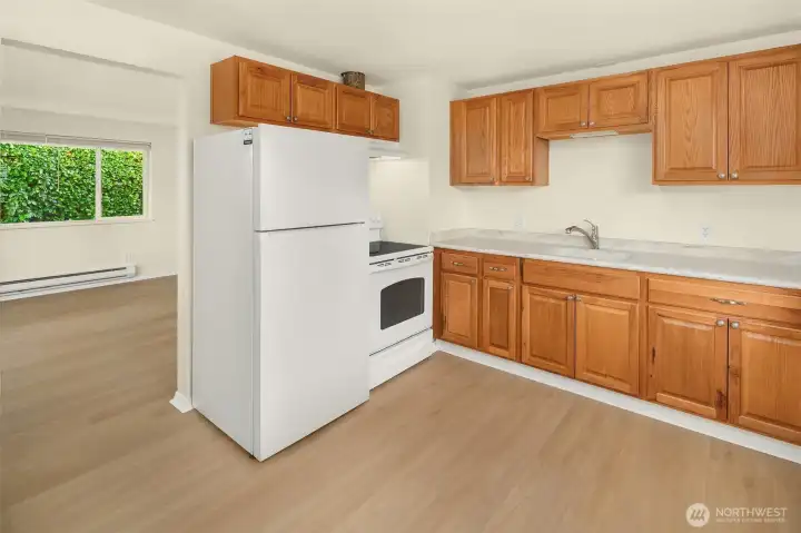 Newer appliances and ample space for kitchen dining