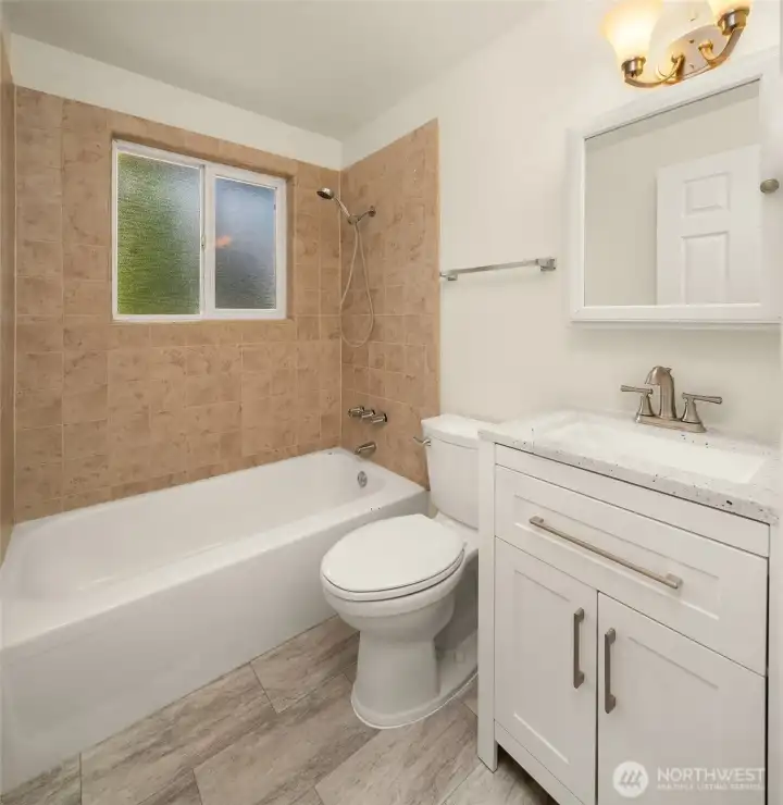 New vinyl flooring, vanity and toilet