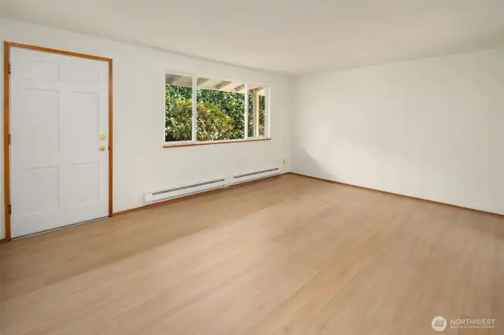 New waterproof luxury vinyl plank in living room, kitchen and hall