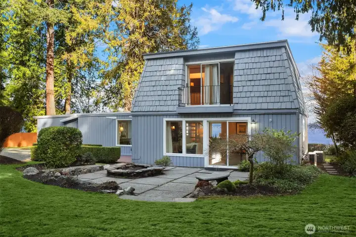 Second floor balcony offers views of forested property.