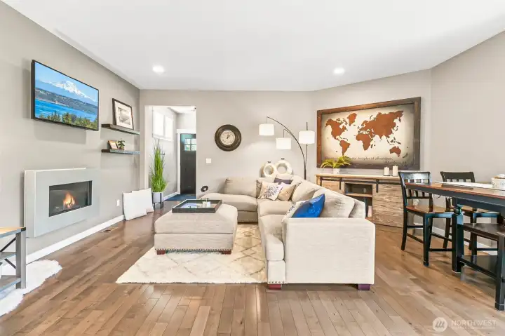Cozy living room features open flow to the dining area -perfect for everyday living & entertaining.