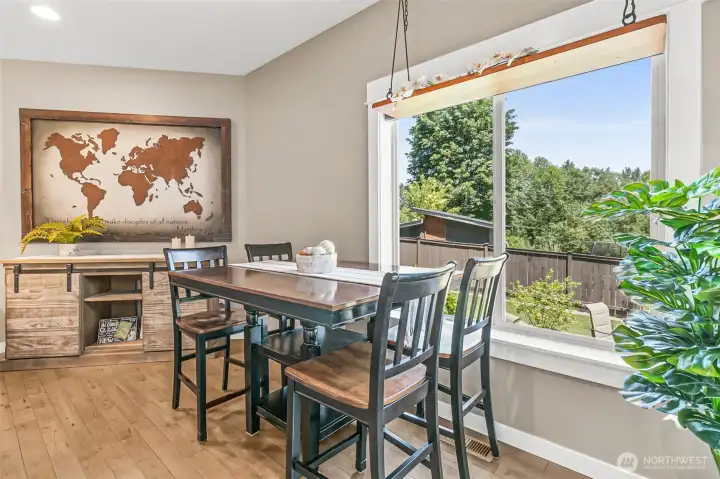 Dining area right off the deck makes a seamless transistion from backyard living.