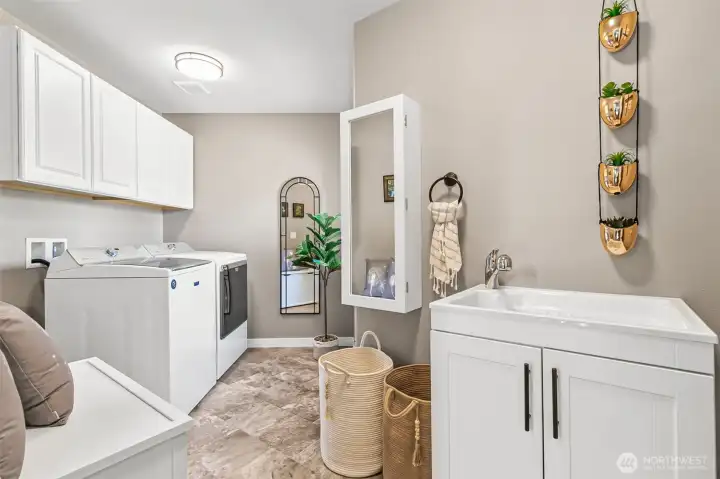 2nd floor utility room makes for easy access & features extra cabinetry