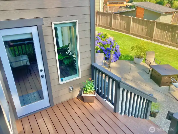 Low maintenance Trex deck just off the spacious patio- creating a seamless space for outdoor entertaining.