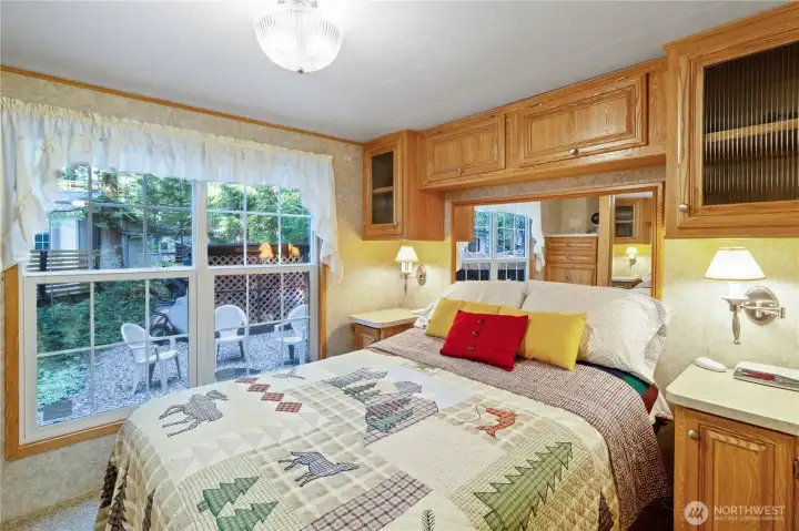 Main floor bedroom w/ built-in cabinets.