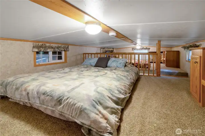 Large loft sleeping area w/ room for multiple beds.
