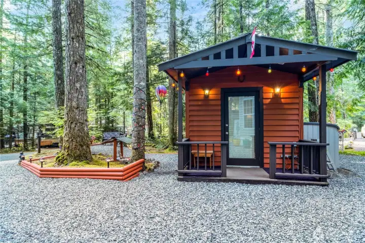 Another exterior view of the shed & surrounding trees.