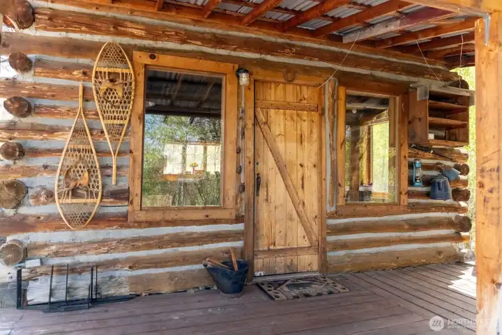 Covered wood deck at front door.
