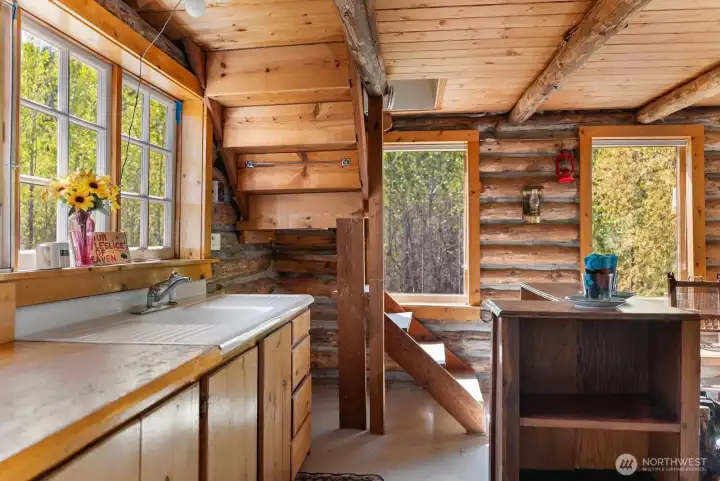 Kitchen has good storage cabinets and counters.