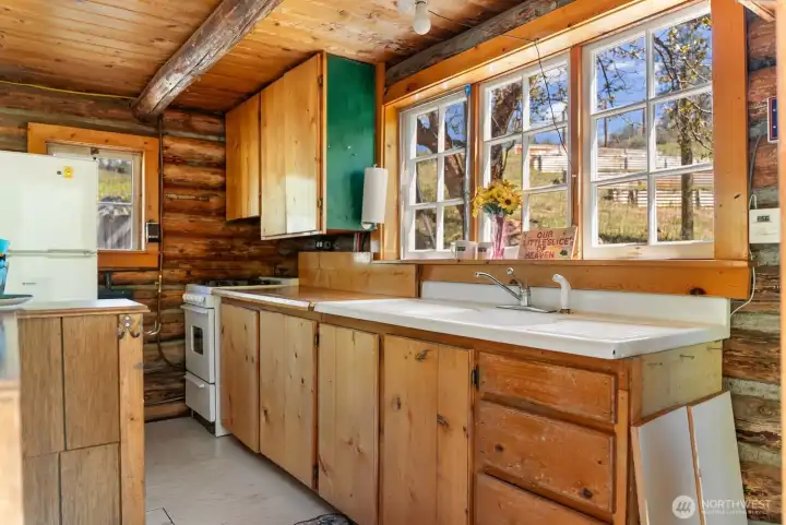 Kitchen appliances include Propane refrigerator, Range oven and stove. Convection propane wall heater 33,000 BTU's main level.