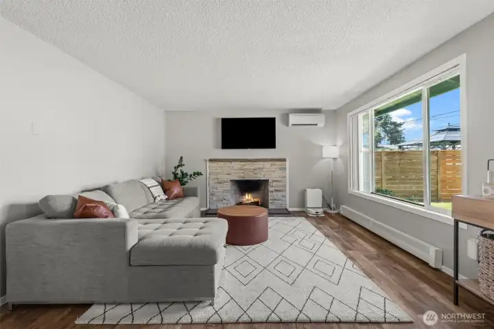 Large living room with a cozy wood fireplace