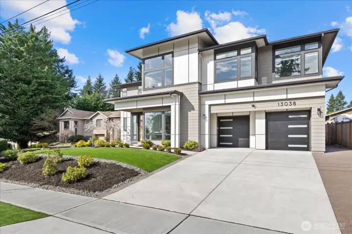 Refined from the very first glance, this 2-year-old Merit Homes luxury residence in Kirkland’s North Rose Hill makes an unforgettable entrance with striking modern curb appeal, manicured turf grounds, and the rare move-in ready feel buyers want in the highly sought-after Lake Washington School District.