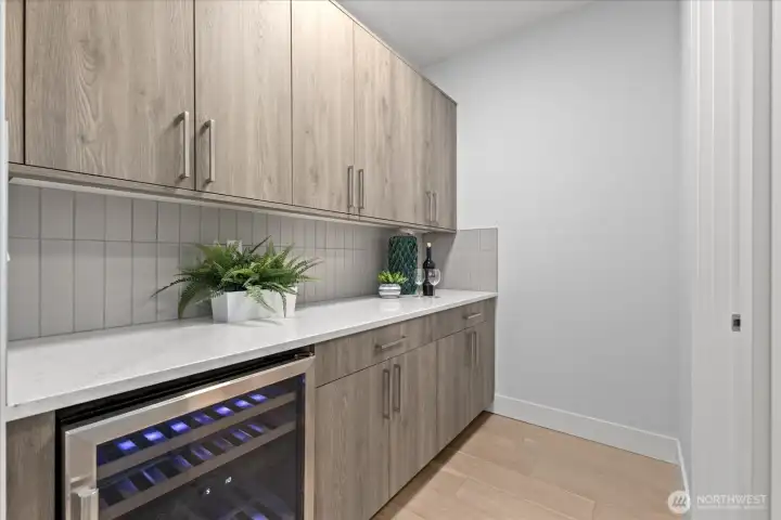 The adjacent prep area with wine chiller adds everyday function and entertaining ease, giving this Kirkland North Rose Hill chef’s kitchen extra storage, serving space, and a polished luxury feel.