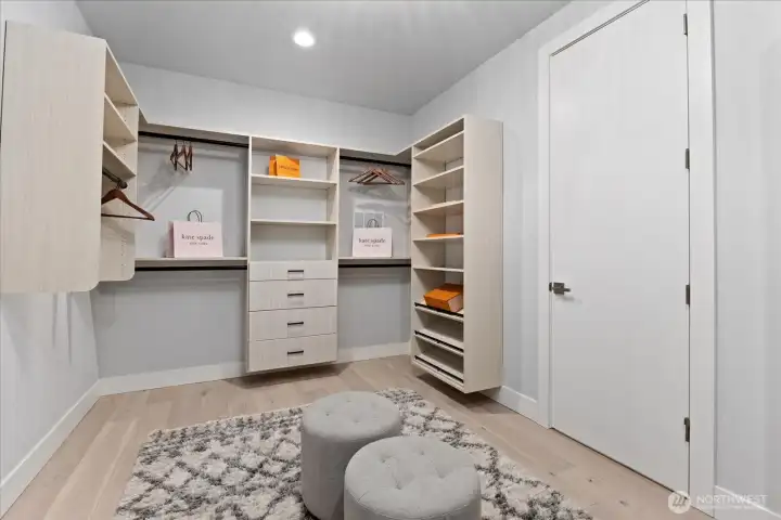 The custom walk-in closet offers built-in organization, generous storage, and a private dressing room feel, adding function and luxury to the primary suite in this Kirkland North Rose Hill home.