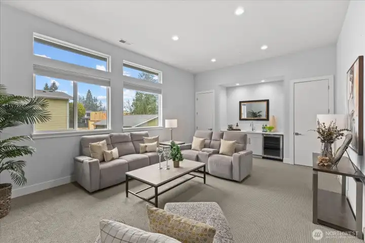 The upper-level bonus room is designed for flexible living with a built-in wet bar sink, wine cooler, and spacious lounge area — ideal for movie nights, entertaining, work, play, or relaxing in this Kirkland North Rose Hill luxury home.