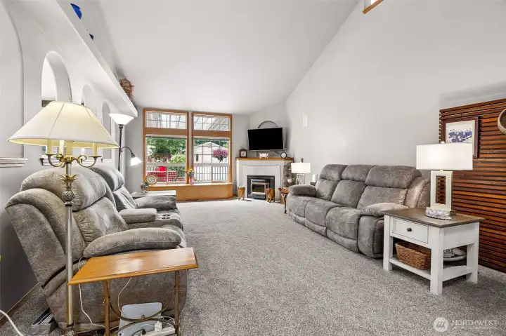 HUGE  Living Room offering vaulted ceilings & wonderful natural light.