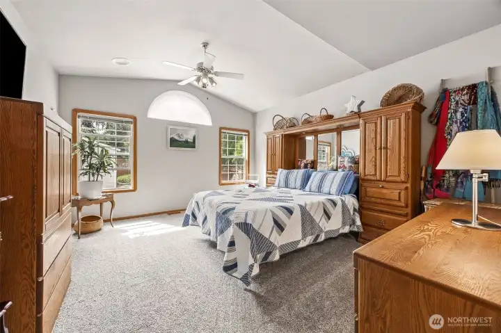 LARGE Primary Suite offering vaulted ceiling, ceiling fan, private Bath & walk-in closet.
