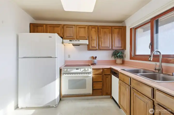 Functional kitchen with storage and counter space.