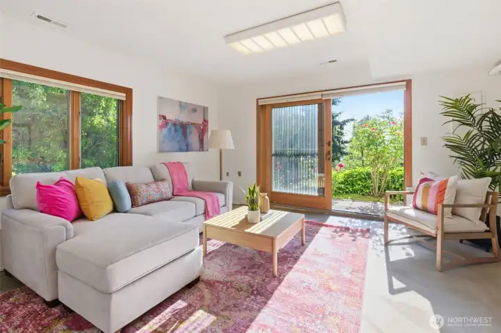 Downstairs family room with sliding door to go outside.