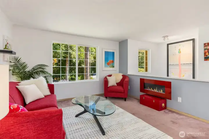 The main living area feels open and inviting, filled with natural light and surrounded by serene views of towering trees. The main living area feels open and inviting, filled with natural light and surrounded by serene views of towering trees.