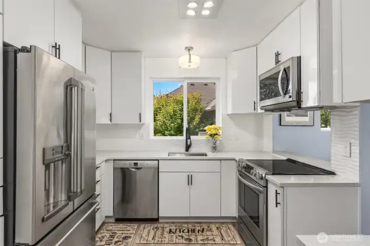 This thoughtfully updated kitchen will be a delight to prepare meals in. Updated in 2022 with new appliances, cabinets, and more. This thoughtfully updated kitchen will be a delight to prepare meals in. Updated in 2022 with new appliances, cabinets, and more.