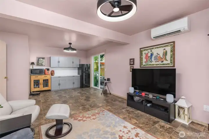 Lower level flex space features a built-in butler's pantry and access to the inviting back deck and yard. Lower level flex space features a built-in butler's pantry and access to the inviting back deck and yard.