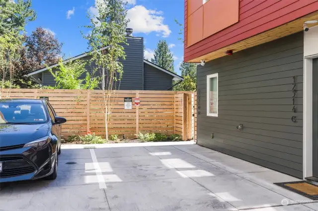 This vacant space is 1 dedicated parking spot directly outside the fence and home.
