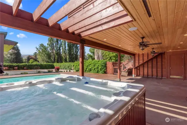 Covered deck with inground pool and jetted hot tub