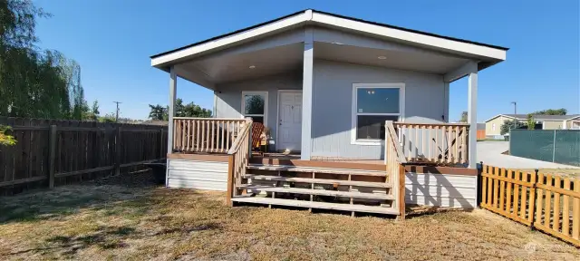 Front Porch with a cozy and private deck with a fenced yard.