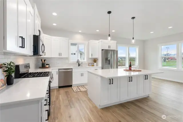 This beautiful kitchen with a large serving island will be great for entertaining.