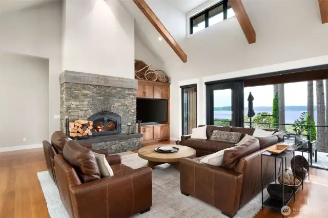 Open concept with wood-burning fireplace and built-in cabinets for the entertaining space. Ready for the next owner to use as a weekend retreat or summer home.